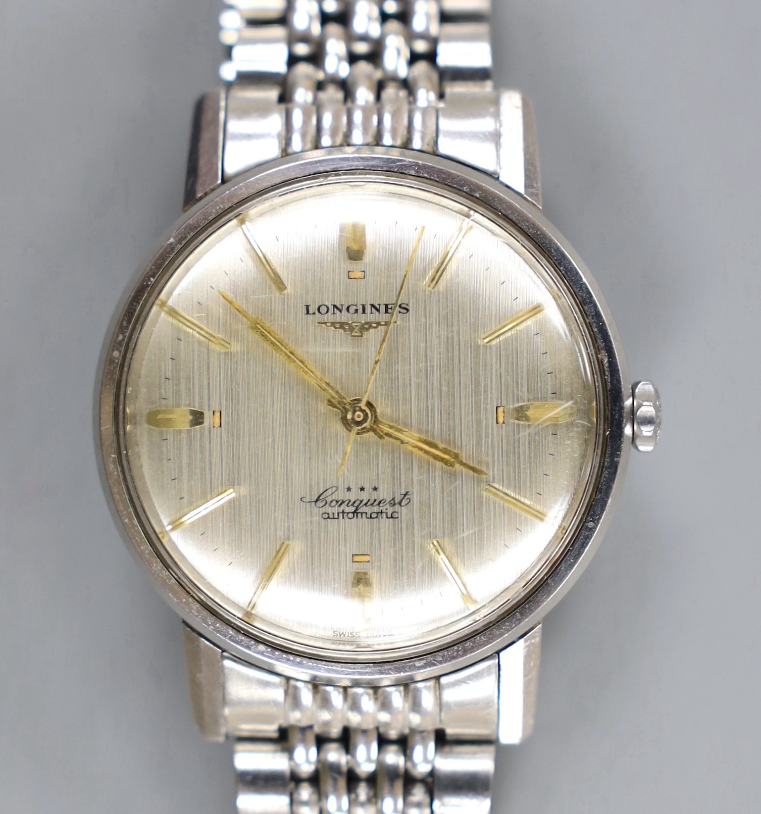 A gentleman's stainless steel Longines Conquest Automatic wrist watch, on associated bracelet.